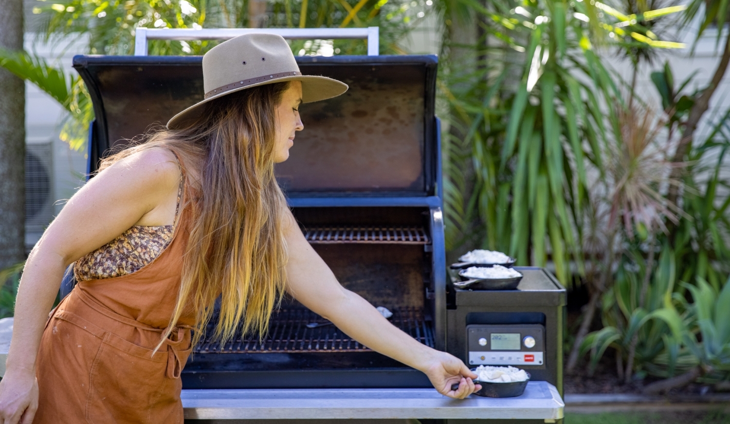 Traeger guide delicious smoked cheesy confit garlic and mushroom pizza